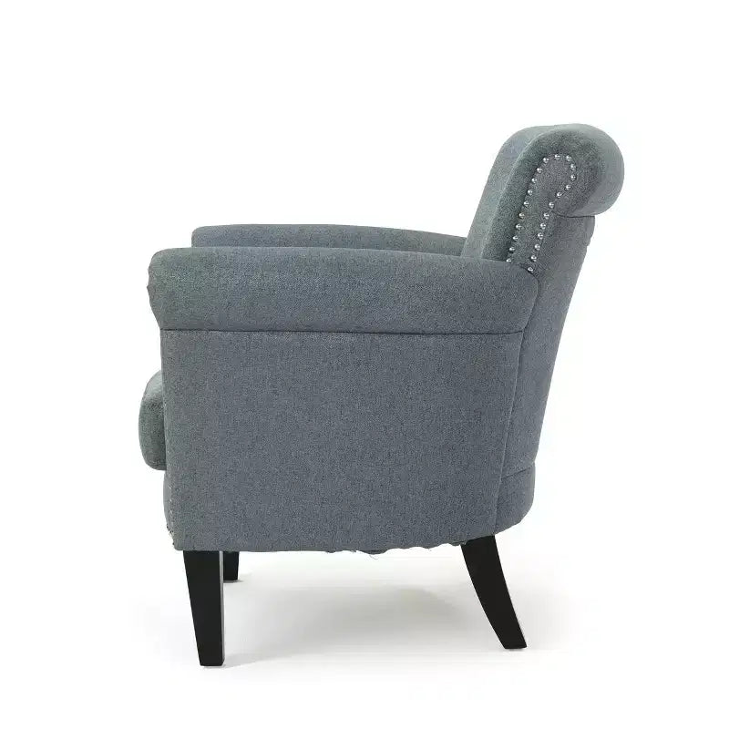 Fauteuil club contemporain en tissu avec garniture cloutée